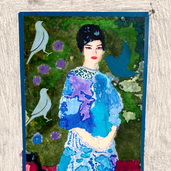 Center of the painting is a woman in a long sleeve, blue and aqua textured dress. She has light skin, dark eyes rimmed in black eyeliner and ruby red lips. She has jet black hair worn in a short, smooth bob. The background behind her is a mixture of dabbled light and dark greens. On top of the green are several small purple flowers and the cutout silhouettes of three blue birds. Near the bottom half of her dress, the background becomes a bright fuchsia shade. A three-inch border neatly trims that entire portrait and is shaded by using short strokes of graphite.